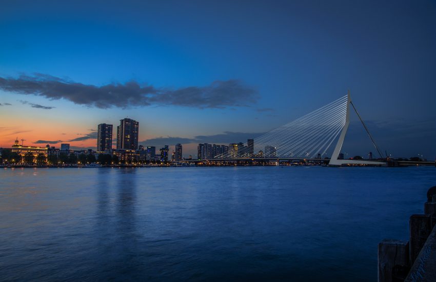 Panorama of Erasmus Bridge (Erasmusbrug) and Rotterdam skyline illuminated at night. Rotterdam, Netherlands © Dmitry Rukhlenko for Shutterstock (ID: 721864855)